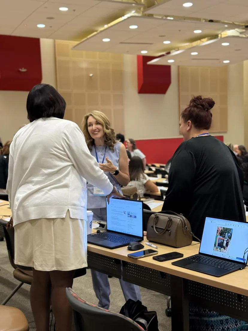 Attendees greeting each other in the main hall