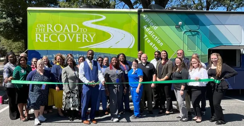 Community gathering at a behavioral health mobile clinic launch
